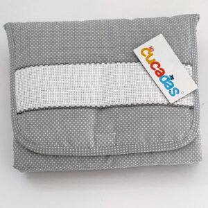 Cambiador con tira para bordar